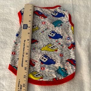Dog sleeveless T-shirt. Very bright and stretchy. Size: Medium Gently used.